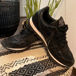 All black vintage style Nike sneakers